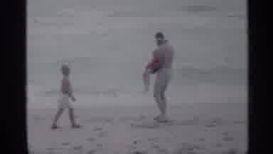 Florida (1958): Dad And His Two Sons Playing On Beach