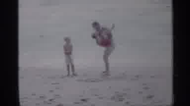 Florida (1958): Man Pretending To Throw Child Into Ocean While ANOther Child