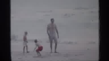 Florida (1958): One Adult And Two Children Playing At Shoreline At Beach