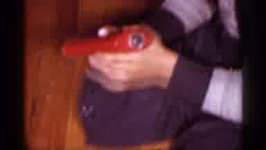 New Jersey (1958): Woman Wearing Blue And Red Robe Plies White Substance On Face