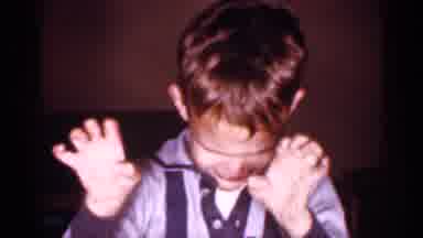 New Jersey (1958): Boy Wearing Blue Shirt Ekes Cary Face At Comer Man