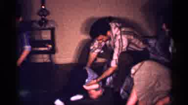 New Jersey (1958): Father Trying To Lift His Youngest Son And People Sitting And