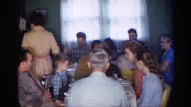 This big, happy family is eating dinner - and their waistbands!