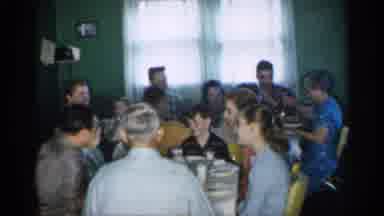 New Jersey (1958): Very Large Family Sitting Round Two Tables Eating Meal Together