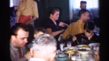 New Jersey (1958): Big Family Gathered Around The Dinner Table While Eating