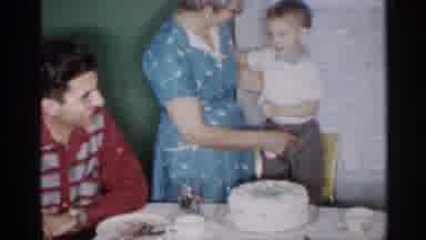 New Jersey (1958): Family Celebrates Young Male Child's Birthday With Cake