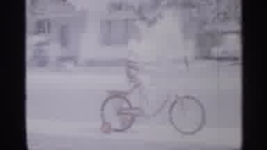 New Jersey (1958): Small Child Showing Someone How He Can Ride His Bike Up And