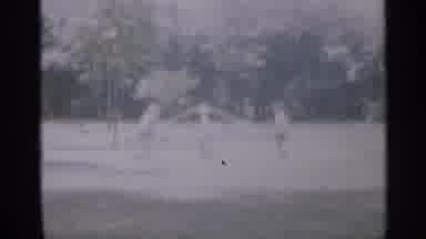 New Jersey (1958): Two Young Boys At Park On Grass Playing With Merry Go Round