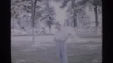 New Jersey (1958): Man Standing In Grass Talking To Person