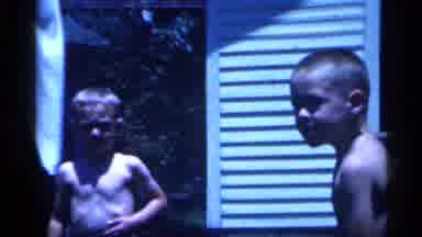 New Jersey (1958): Two Kids With No Shirt Playing With Pint Together Outside