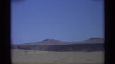 Arizona (1959): View Father On Moving Car Of Wide Open Land With Small Mountains