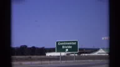 Arizona (1959): Sign Stating Continental Divide Points Towed A Exit Alongside