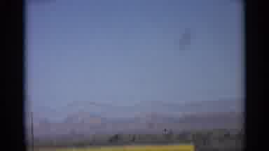 Arizona (1959): Driving Down Open Rod Capturing Large Mountain Tops In Background