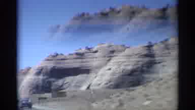 Arizona (1959): Cliff Side In Desert With Rod And Truck Next To It