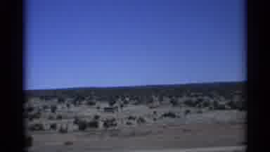 Arizona (1959): Film Father On Moving Car Of Homes In Desert During Day