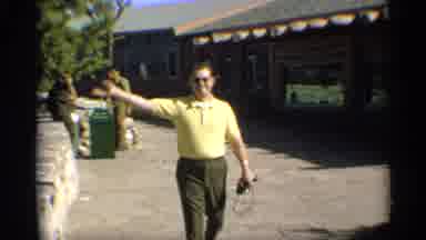 Arizona (1959): Man Walking And Waving Goodbye While Passing By Bin In Mountains