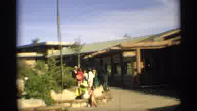 Arizona-1959: People Gather At Rustic Lodge With Stone Benches And Canyon Views