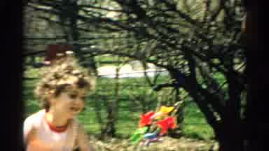 Arizona (1959): Girl Wearing Grandmother Shirt Holds Multi Colored Pinwheel On