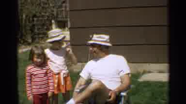 Arizona (1959): Man Sitting In Lawn Chair Outside Talking To Two Young Girls