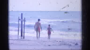 California (1959): Father And His Son Walking In Sn Towards Ocean Edge