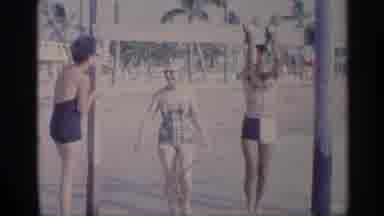 California (1959): Man Outperforms Pull Ups On 1x4 Ben Nile To Poles On Beach With