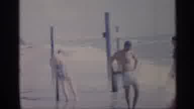 California (1959): People Hanging By Seaside While Kid Runs Round