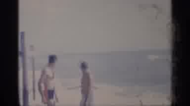 California (1959): Adults And Child On Beach S Eves Roll Onto Shoreline On Sunny