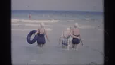 California (1959): Three Women Walk Into Ocean At Earshot One Is Carrying Round