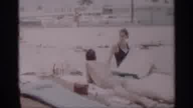 California (1959): Man And Woman At Beach On Sn On Howells In Surf Ocean Sea