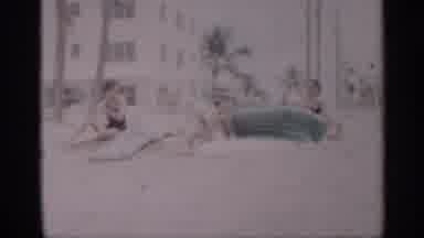 California (1959): People Hippy And Smiling While Putting Sunscreen On Air Skin