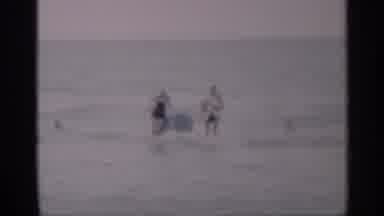 California (1959): People Walking Through Water S Y Head Back To Sandy Earshot On