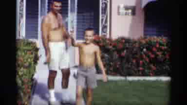 California (1959): Boy Wearing Grey Shooter Eves Red Object At Comer Man