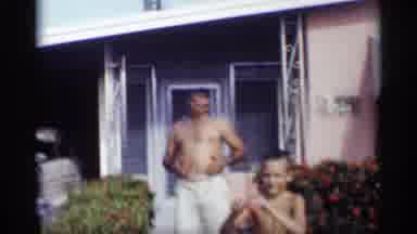 California (1959): Boy Wearing Grey Shooter Eves Red Flower In Father Officer