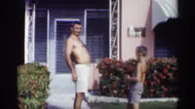 California (1959): Two Shirtless People Standing Cross Father On One Another