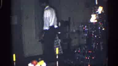 California (1959): Man Wearing White Shirt Looks Father Spot To Pace Gift Box One