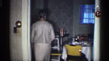 California (1959): Man Sitting In Chair S Woman Walks Into Room And Pushes In