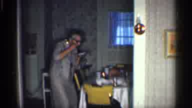 California (1959): Woman Pretending While She Dances Inside Of Kitchen