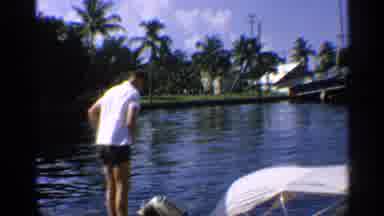 California (1959): Man Wearing Blue Shooter Looks Down At Water Father On Side Of