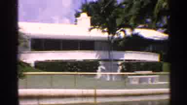 California (1959): White Building And Pink Bungalow On Sunny Day