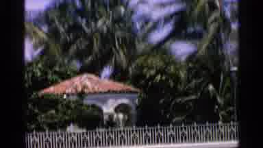 Florida (1959): Behind White Fencing Is White House With A Grandmother Terra Cotta