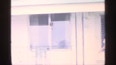 Florida (1959): Boy Wearing Blue Ants Dances In Father Of White Building On Sunny