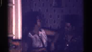 Florida (1959): Man Women Sitting Shifting Up And Down Smiling Moving White Shirt