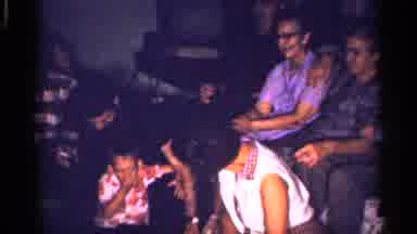 Florida (1959): Woman Wearing White Shirt Looks At Comer While Sitting On Flo