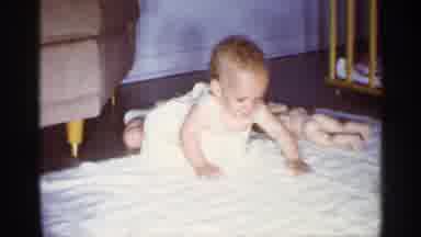 Florida (1959): Red Headed Baby Girl Wearing White Dress And Shoes Trying To Crawl