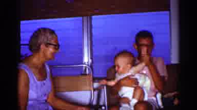 Florida (1959): Grinning Boy Eves Rm Of Baby On His Lip At Hippy Elderly Woman