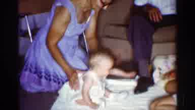 Florida (1959): Person Playing With Bear Holding It Up To Baby