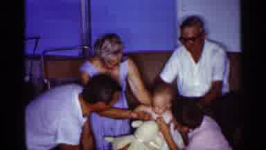 Florida (1959): Family Teaching Child How To Walk With Help Father On Stuffed
