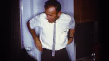 Florida (1959): Man Squatting Down To Talk To Another Man Sitting In Lawn Chair