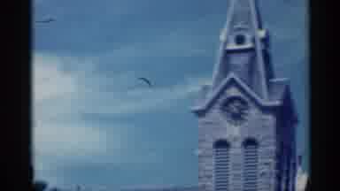 Indiana (1959): Grey Clock Tower Gins Blue Sky On Sunny Day