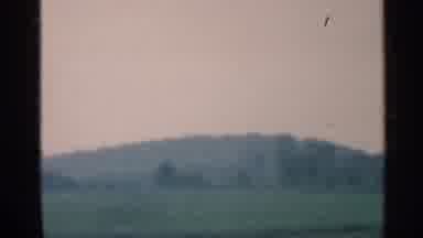 Indiana (1959): Cars Are Driving Fast On Rod With Beautiful Landscape Round